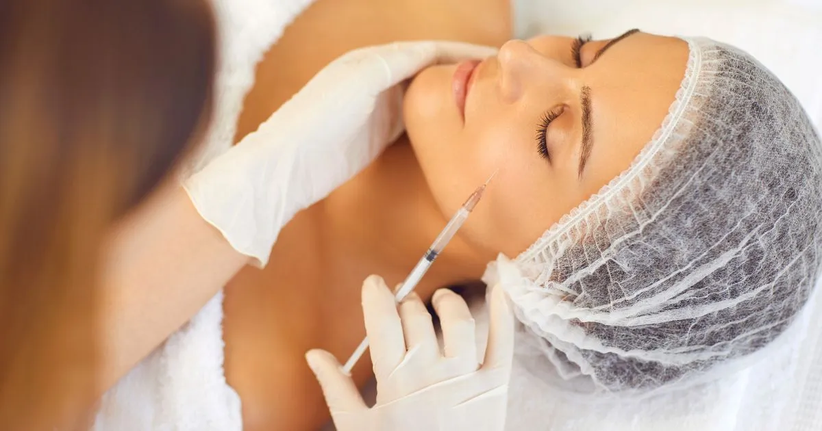 Bellafill dermal filler injection on a woman's cheek in Warren, OH clinic