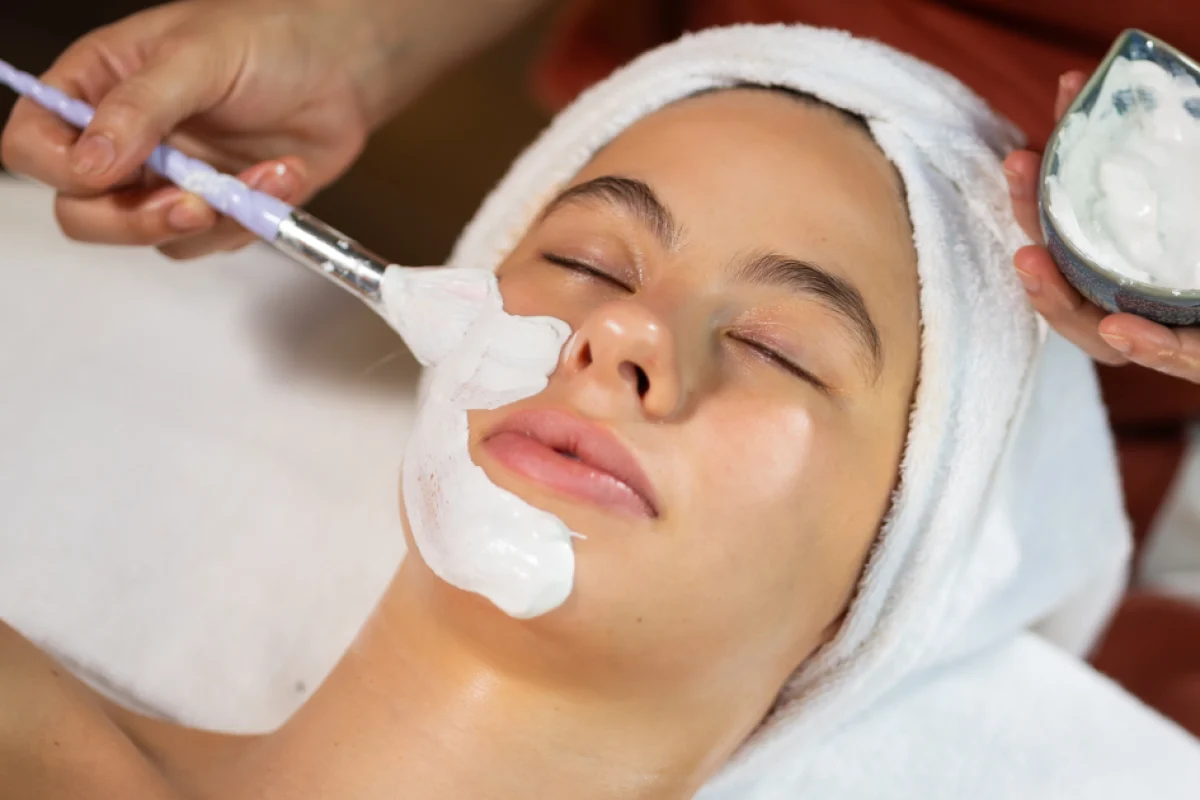 Woman receiving a customized facial from a doctor in Warren, OH